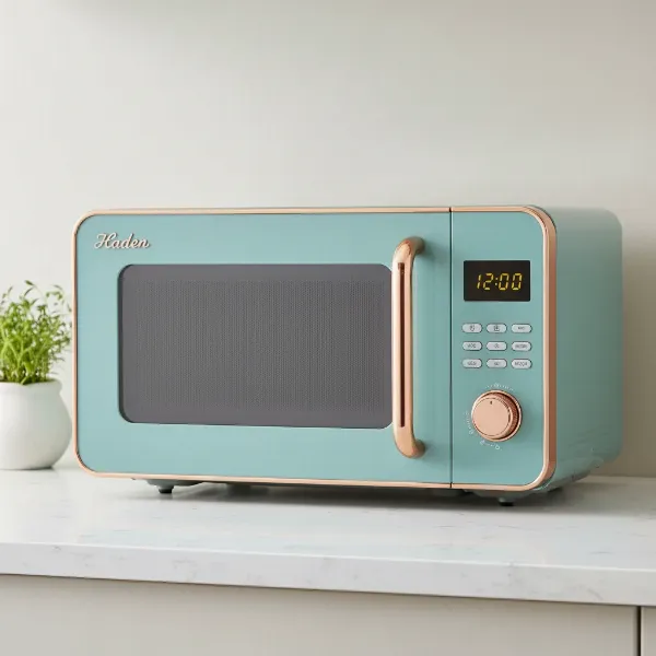 Haden Heritage Microwave in a turquoise color with copper accents, showcasing its vintage design.