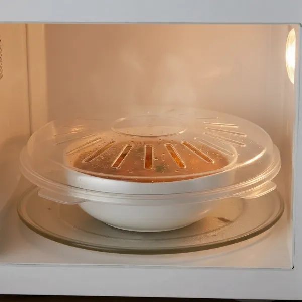 Microwave splatter cover protecting the microwave interior during heating.