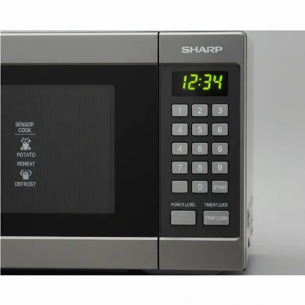 Close-up of a Sharp Carousel microwave control panel with one-touch presets